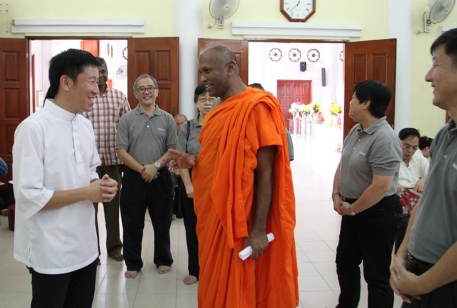 Bro. Tan and Nalandians greeting Ven. Saranankara on his birthday.