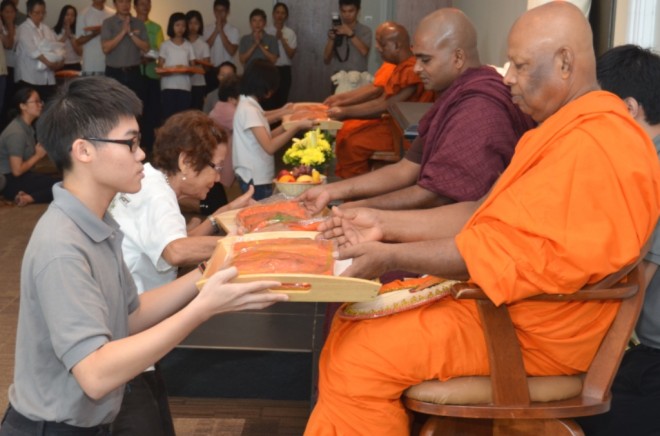 Young and old came to support the monastic community on Sangha Day.