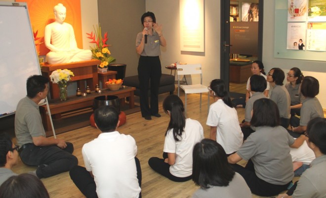 Sis. Sandy giving a Dhamma-sharing at NEO Centre Happy Garden.