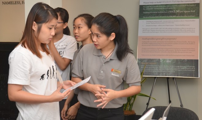 Participants making enquiries at the Help Desk.