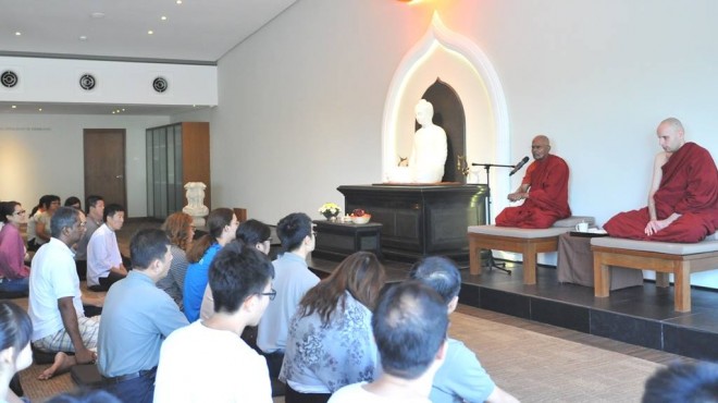 Venerable Gunaratana giving a Dhamma teaching; with him is Venerable Mangala (right).