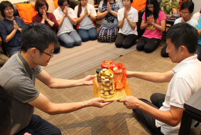 Nalandians presenting a token of appreciation to their teacher and mentor, Bro. Tan.