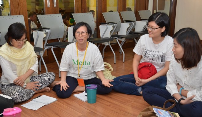 Group discussion on observing the 5 precepts.