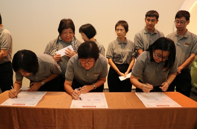 Branch Secretaries signing their service pledge.