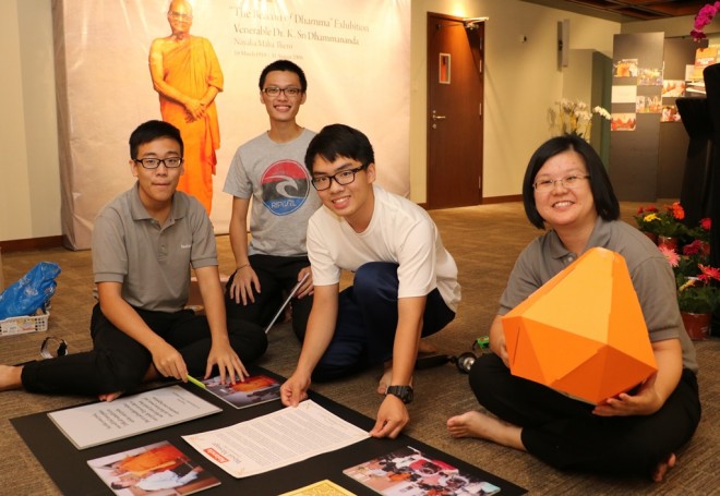 Volunteers preparing the exhibition hall on Wesak eve.