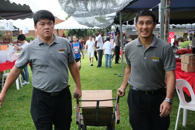 Nalandians helping with the unloading and setting up of stalls.