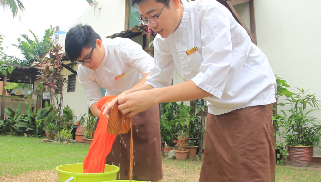 Facilitators and students took turns to participate in the robe washing.