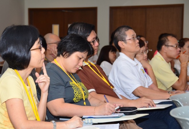 Participants listening attentively to the lecture.