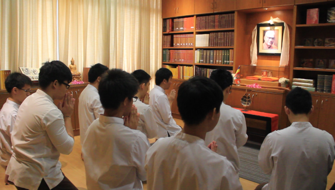 The appointed Dhamma School facilitators and students paid respects at the K. Sri Dhammananda altar.