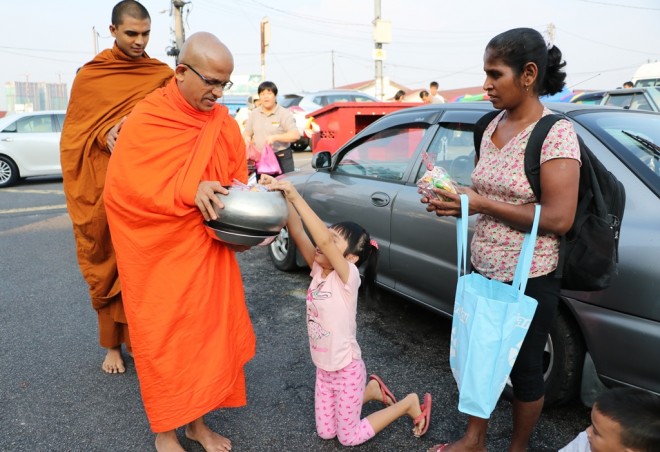 A regular sight at this market - children offering alms.