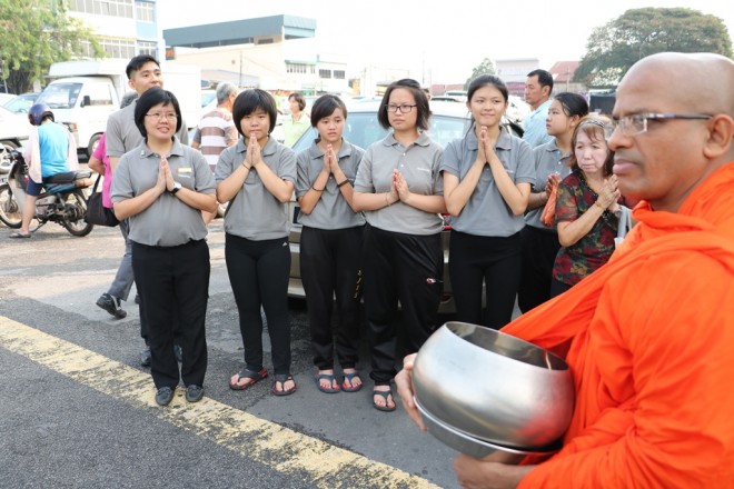 School Director Sis. Sunanda leading her students to take part in the alms-round programme.