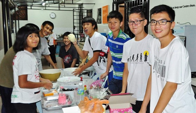 Dhamma School students making mooncakes.