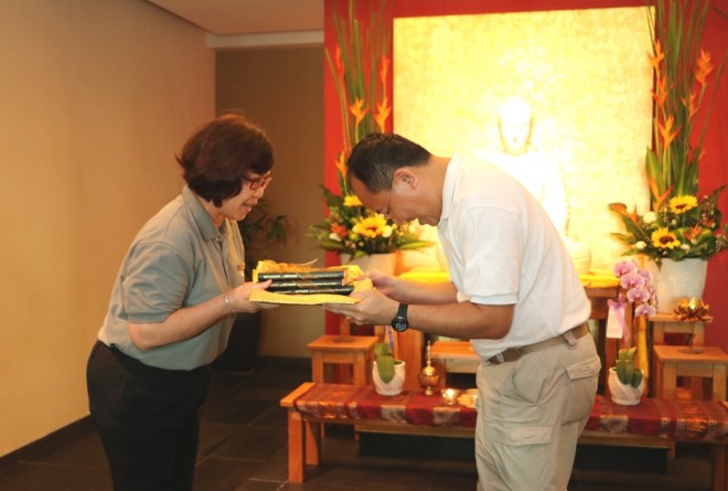 Sis. Evelyn presenting copies of  “Without & Within” to Dr. Ng.