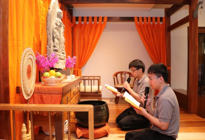 Bro. Leiken and Disheng leading the youths in offerings and chanting.