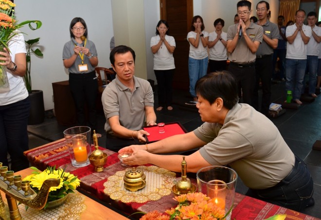 Customary offerings to the Buddha, Dhamma and Sangha.