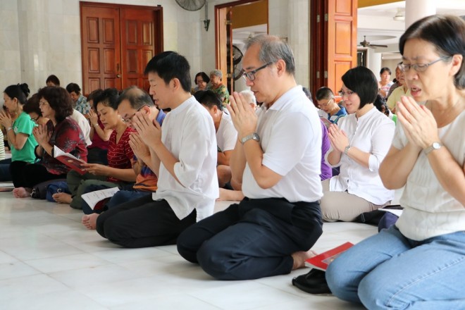 Nalandians joining devotees for Pūja.