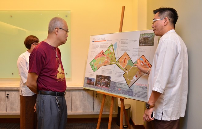 Bro. Charlie briefing Dr. Wong on Wisdom Park.