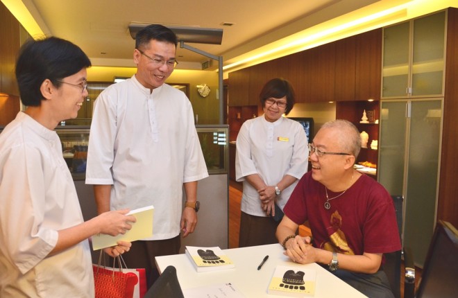 Dr. Wong chatting with Library Manager Sis. Santi.