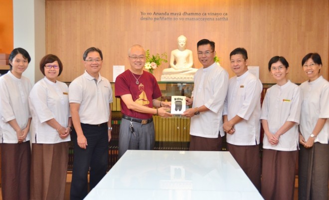 Dr. Wong presenting his book to Nalanda Library