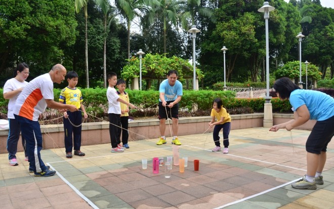 Parents and children playing together.