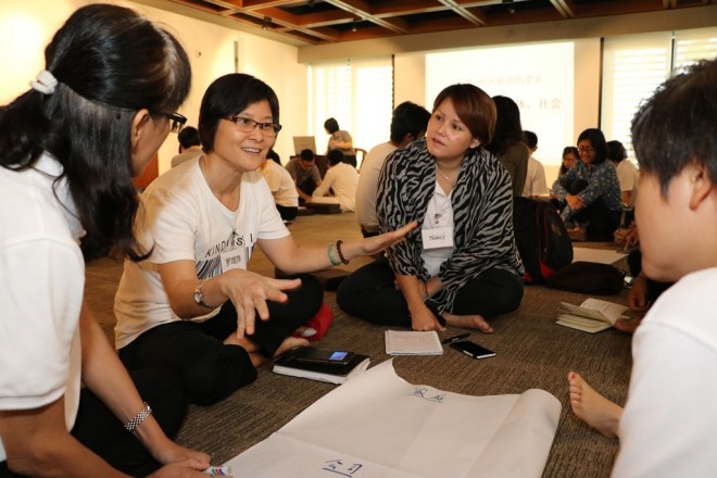 Devotees having a discussion after the talk.