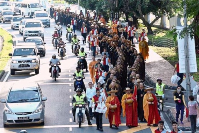 The disciplined procession of Sangha members through the streets of George Town, Penang.