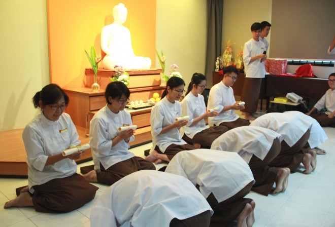 Students receiving their certificates from teachers.