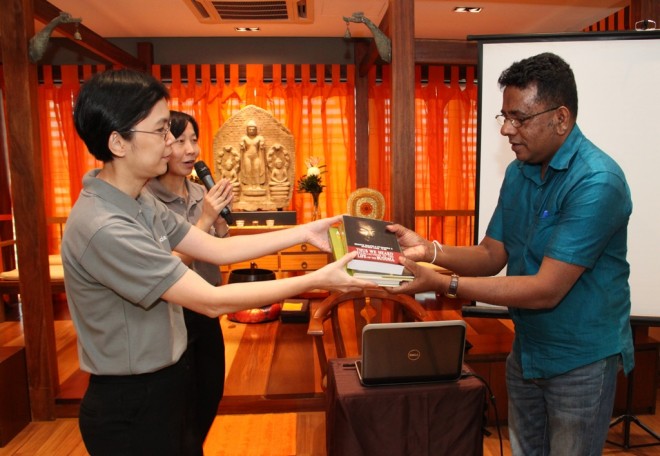 Dr. Shantha Abeysinghe from Sri Lanka, donating some publications to Nalanda Library.