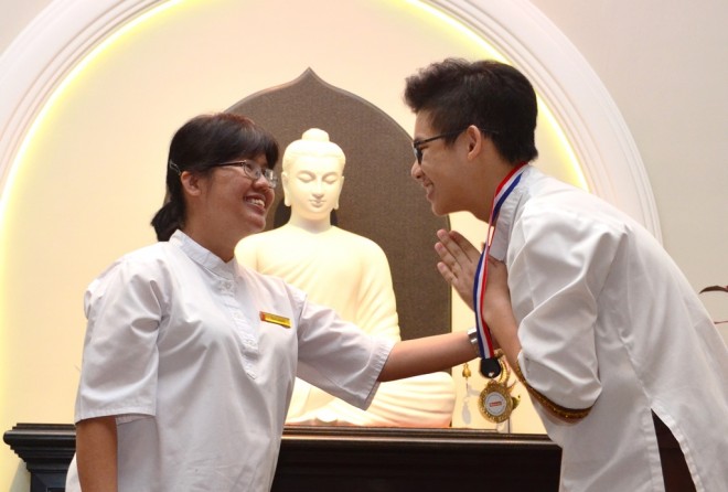 School Director Sis. Sunanda congratulating Garuda House Captain Neville Lee.