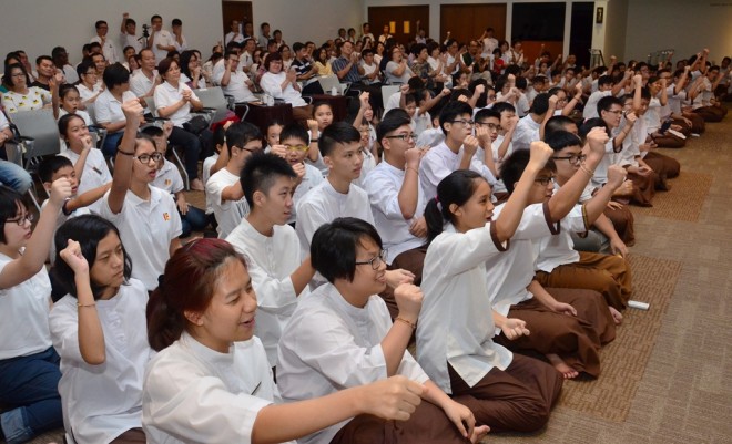 Students cheering for their friends who receive various awards.