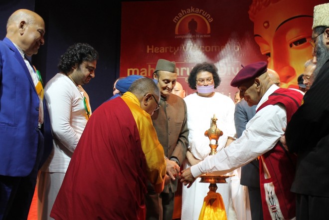 Leaders of multi-faiths lighting a ceremonial lamp to inaugurate the gathering.