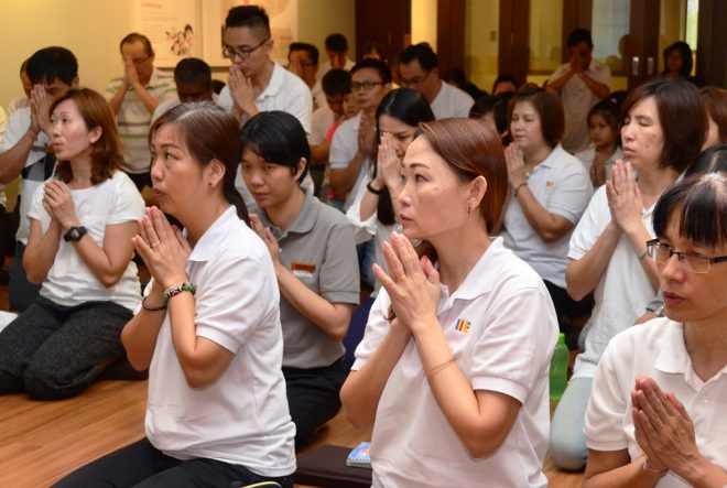 Chanting with concentration and devotion.