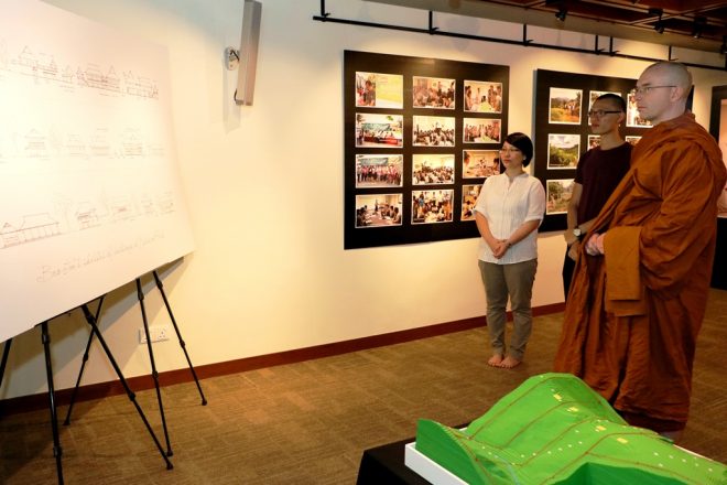 Sis. Nandini and Bro. Ajita leading Ajahn on a building tour.